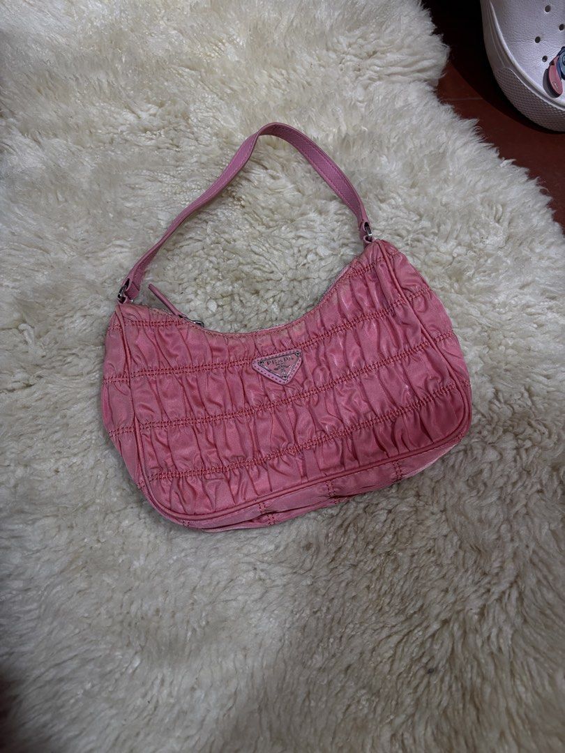 Prada Pink Ruched Nylon Mini Shoulder Bag (Category: Luxury Bags & Wallets) located in Baguio. Submitted by thriftedbaguio (Listing ID 1464870447, Image 1). Description: Very Good Condition .