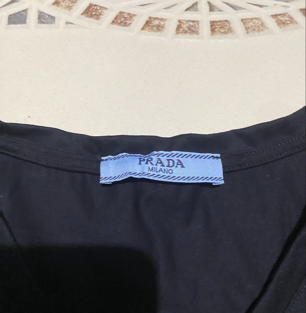 Prada shirt(womens) (Category: Blouses) located in Cebu City. Submitted by hustler_69 (Listing ID 1464901325, Image 3). Description: Prada shirt(womens) Size medium 16.5 width 23 length Excellent condition Details are all posted.