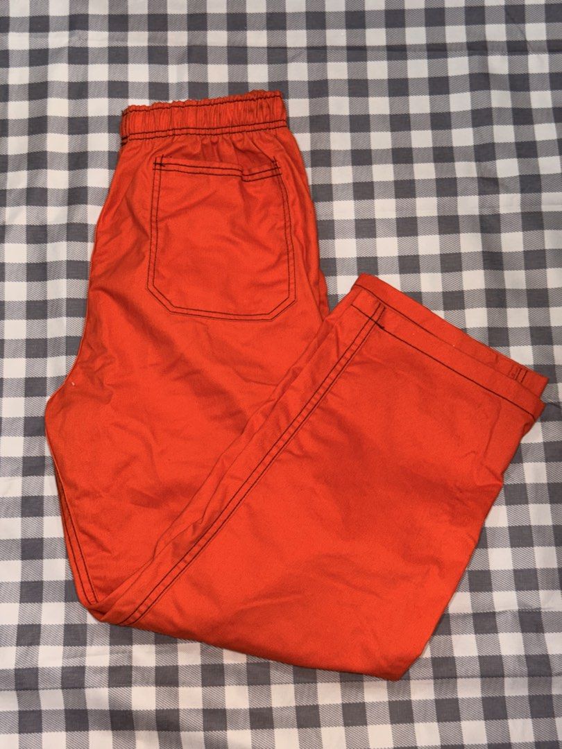 Preloved - Cargo pants 🧡 (Category: Joggers) located in Manila. Submitted by littlefindsbyb (Listing ID 1464776617, Image 2). Description: 🧡 Bright Orange Relaxed-Fit Cargo Pants Bold and stylish orange cargo pants featuring contrast black stitching — a statement piece that’s easy to dress up or down. Details: • Brand: Undertake • Elasticated waistband with white drawstring • Relaxed, loose straight-leg fit • Side cargo pockets • Back patch poc