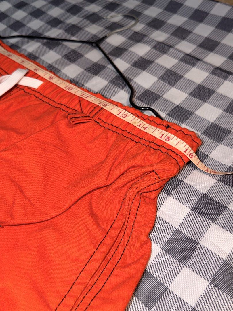 Preloved - Cargo pants 🧡 (Category: Joggers) located in Manila. Submitted by littlefindsbyb (Listing ID 1464776617, Image 3). Description: 🧡 Bright Orange Relaxed-Fit Cargo Pants Bold and stylish orange cargo pants featuring contrast black stitching — a statement piece that’s easy to dress up or down. Details: • Brand: Undertake • Elasticated waistband with white drawstring • Relaxed, loose straight-leg fit • Side cargo pockets • Back patch poc