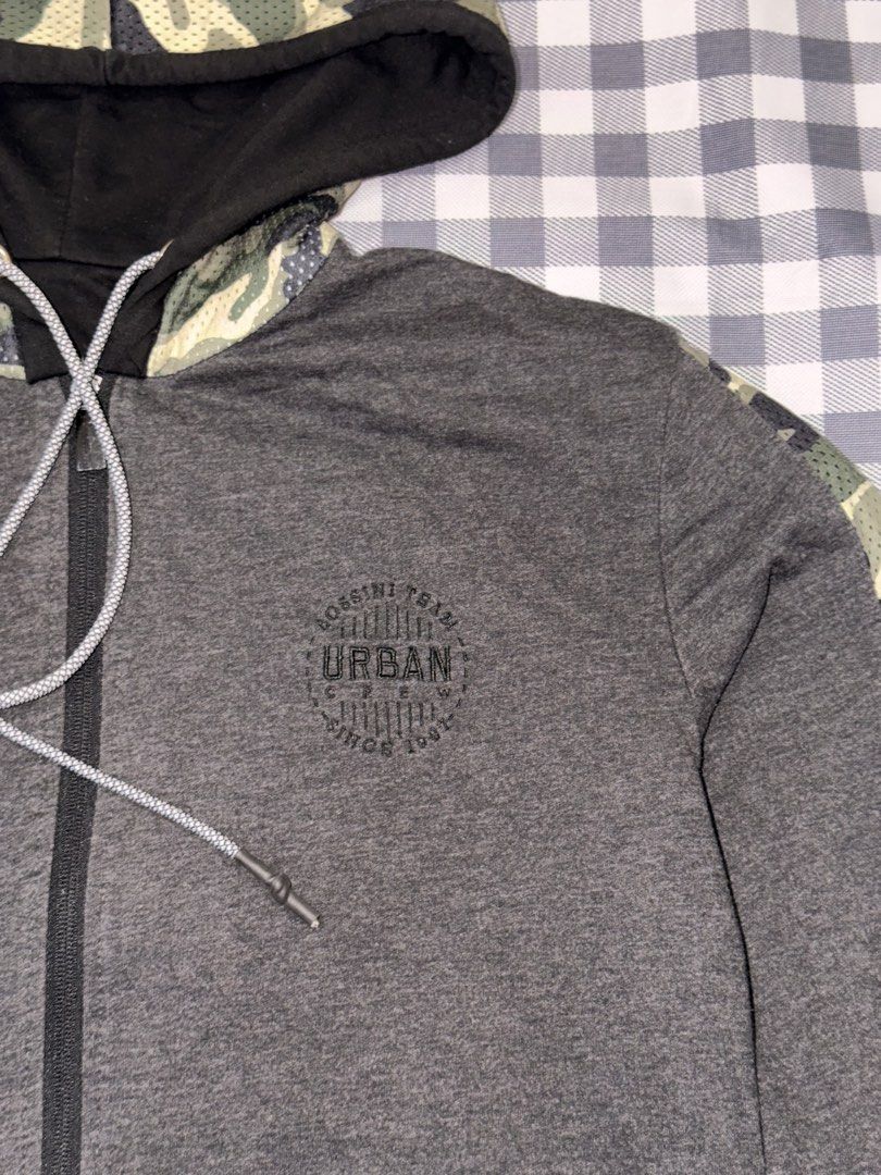 Preloved- Bossini Reversible Zip-Up Jacket 🧥 (Category: Coats, Jackets and Outerwear) located in Manila. Submitted by littlefindsbyb (Listing ID 1464780929, Image 1). Description: 🧥 Preloved Bossini Reversible Zip-Up Hoodie Jacket 🧥 2-in-1 style! Wear it two ways — sleek solid black or grey with camo sleeves. Two looks in one versatile piece! 😎 📏 Measurements: • Chest: ~40–42” • Length: ~27–28” • Best fits Medium 👕 Details: • Brand: Bossini