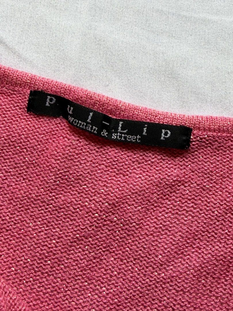 Puli-p Pink Knit Cardigan (Category: Coats, Jackets and Outerwear) located in Santa Rosa. Submitted by itskllycstll (Listing ID 1464913036, Image 2). Description: - Brand: Puli-p woman & street - Style: Open front pink knit cardigan with neck tie strings - Details: Textured open-weave knit on lower body and sleeves - Special Feature: Subtle metallic threading for a gentle shimmer - Finish: Scalloped trim edging on cuffs and bottom hem.