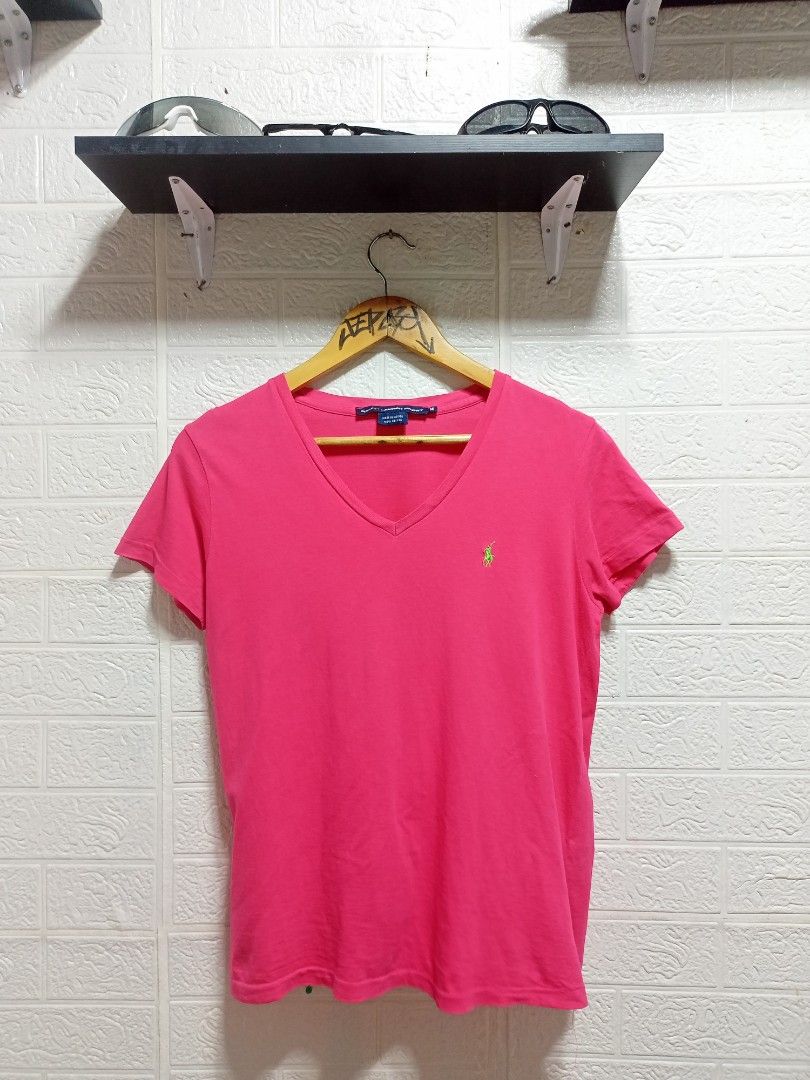Ralph Lauren (Category: Blouses) located in Danao, Cebu. Submitted by 6000thrifts.ph (Listing ID 1464821822, Image 1). Description: - Brand: Ralph Lauren Sport - Style: V-neck short-sleeve t-shirt - Color: Vibrant Pink with green embroidered logo - Size: Medium (M) - Material: 100% Cotton (Made in Mexico) - Condition: Excellent pre-owned condition, soft and breathable fabric.