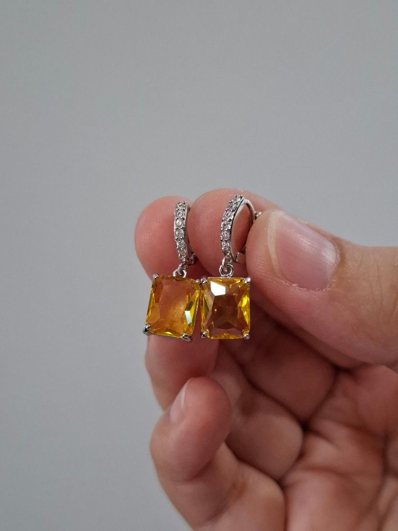 Rectangular Cut Citrine Colored Crystal Dangling Earrings (Category: Earrings) located in Dasmarinas. Submitted by danabrie22 (Listing ID 1464864664, Image 2). Description: very well-made, excellent crafstmanship 10/10 condition brand new stainless steel & yellow & white crystal-colored cubic zirconia stones made in Hongkong.