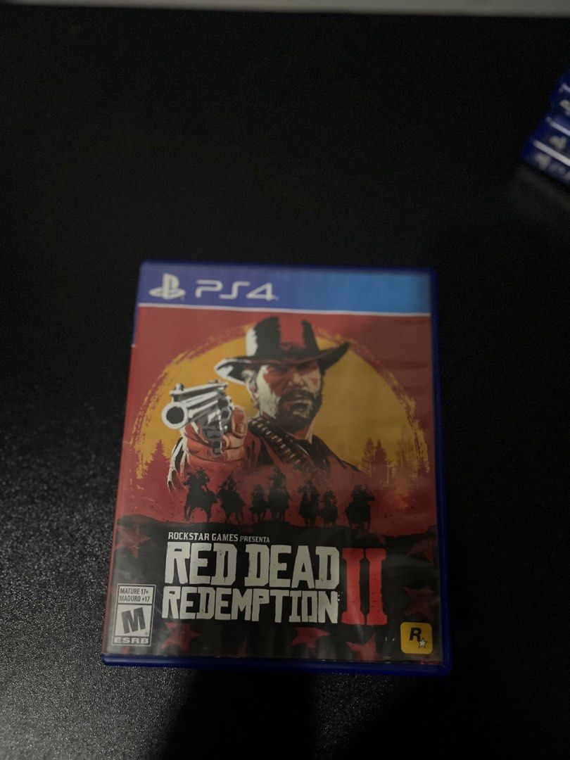 Red Dead Redemption 2 PS4 Game (Category: PlayStation) located in Gapan. Submitted by jamminandcrackin (Listing ID 1464781707, Image 1). Description: - Title: Red Dead Redemption 2 - Platform: PlayStation 4 (PS4) - Publisher: Rockstar Games - ESRB Rating: M for Mature - Condition: Includes original blue keep case and intact cover artwork.