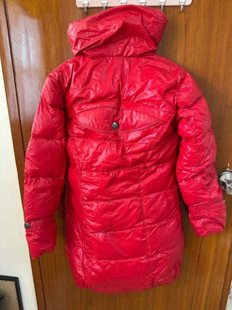 Red Quilted Long Puffer Jacket With Hood (Category: Coats, Jackets and Outerwear) located in Caloocan City. Submitted by mylove326 (Listing ID 1464922933, Image 3). Description: Red winter puffer jacket. Long cut, very warm and cozy. High neck with attached hood. Front zipper closure hidden under a buttoned placket. Two zippered angled pockets on the chest area. Quilted pattern all over. Measurements shown in pictures. Zipper and snap buttons wor