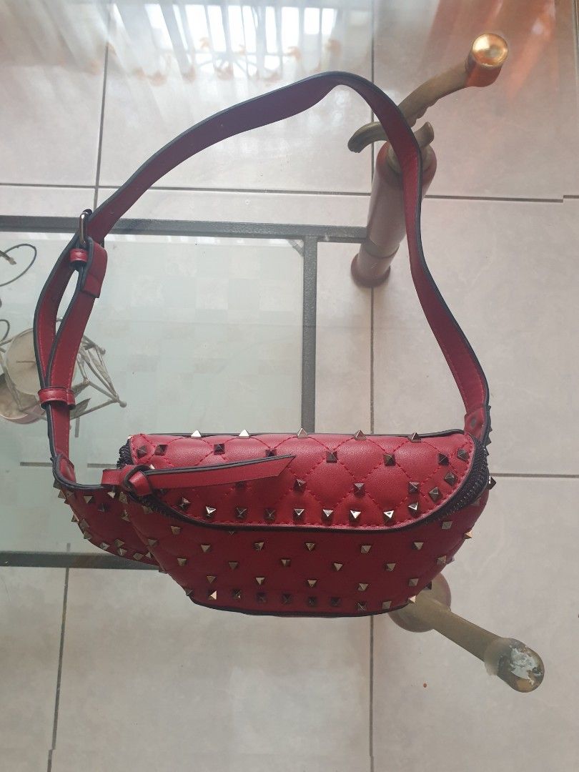 Red Quilted Studded Crossbody Bag (Category: Cross-body Bags) located in Bulacan. Submitted by mango_graham. (Listing ID 1464778366, Image 1). Description: - Color: Bold Red - Design: Metal studs with a quilted flap - Closure: Top zipper closure - Strap: Adjustable with buckle - Interior: Clean red fabric lining with a zippered side pocket - Origin: Made in China tag inside - Condition: Super clean, exterior and interior in great shape!.