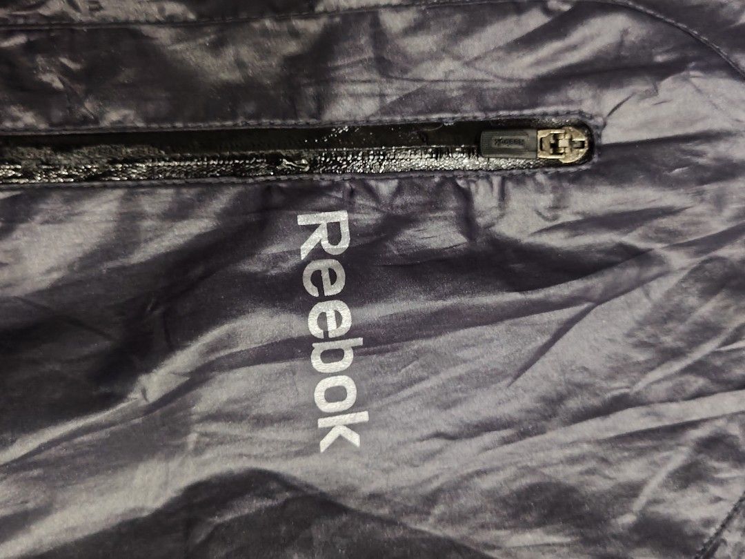 Reebok Windbreaker Jacket Size 105 Navy Blue (Category: Activewear) located in Caloocan City. Submitted by moneyhunt25 (Listing ID 1464851942, Image 3). Description: - Brand: Reebok - Color: Navy Blue - Size: 105 (fits like Men's L/XL) - Lightweight windbreaker with breathable mesh lining - Full zip front closure - Secure zip chest pocket with Reebok logo - Elastic cuffs and hem for a snug fit - Perfect for running, workouts, or casual everyday w