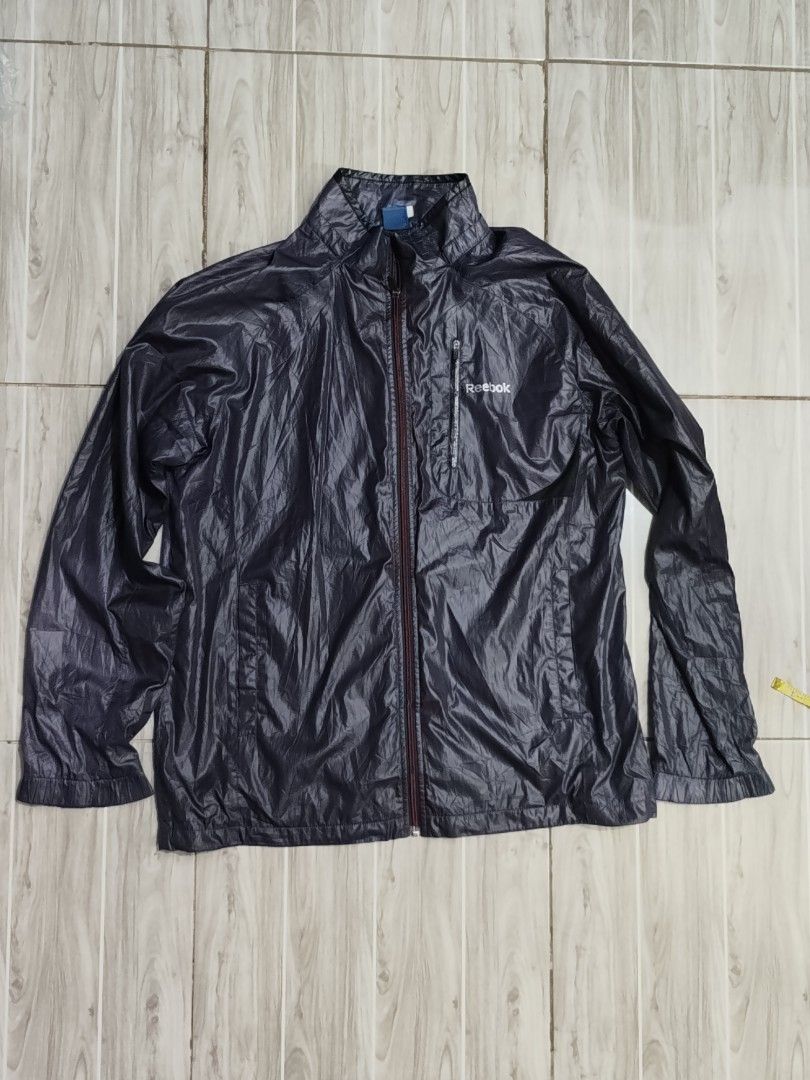 Reebok Windbreaker Jacket Size 105 Navy Blue (Category: Activewear) located in Caloocan City. Submitted by moneyhunt25 (Listing ID 1464851942, Image 1). Description: - Brand: Reebok - Color: Navy Blue - Size: 105 (fits like Men's L/XL) - Lightweight windbreaker with breathable mesh lining - Full zip front closure - Secure zip chest pocket with Reebok logo - Elastic cuffs and hem for a snug fit - Perfect for running, workouts, or casual everyday w