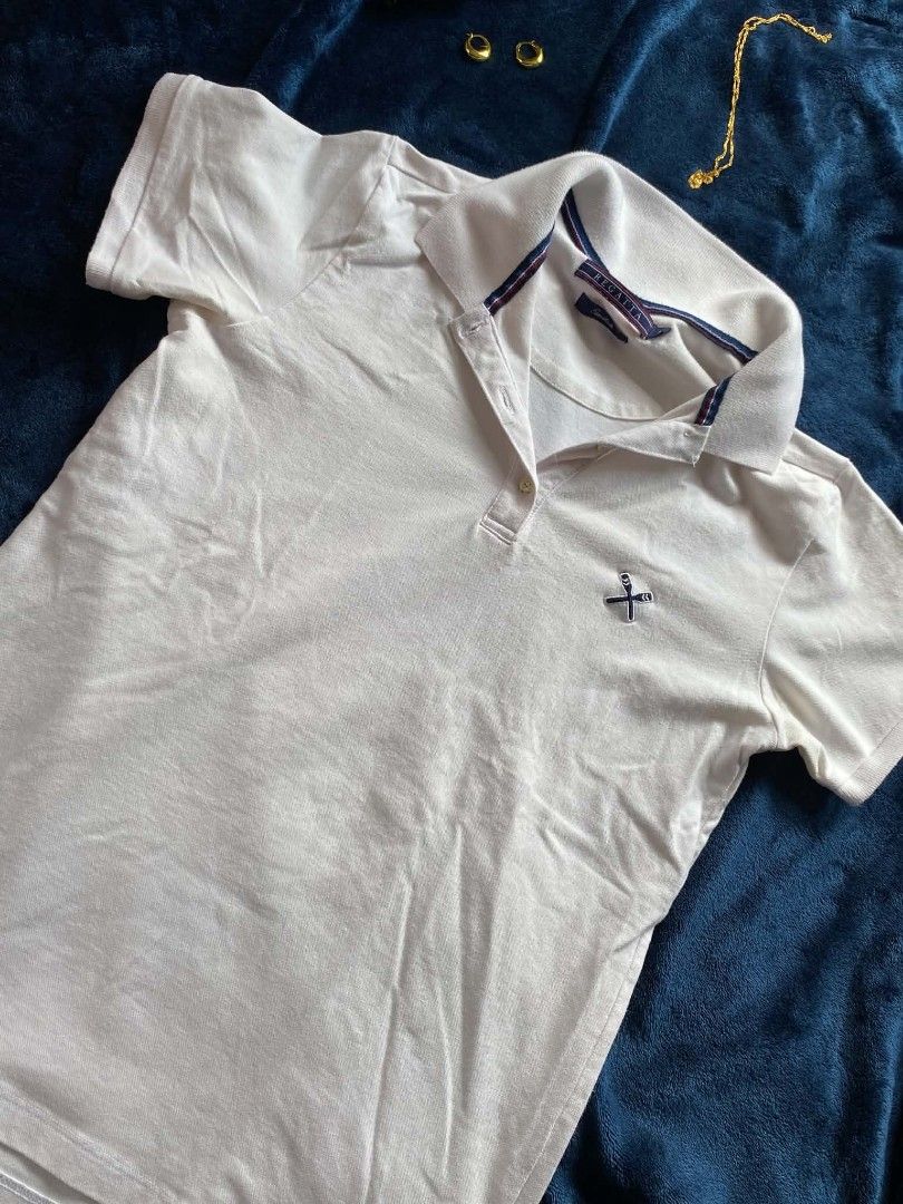Regatta White Polo Shirt Essentials (Category: Tshirts & Polo Shirts ) located in Manila. Submitted by gabbuysells (Listing ID 1464892091, Image 1). Description: - Brand: Regatta Essentials - Size: Small - Color: White with navy and red collar stripes - Material: Cotton pique - Features: Short sleeves, classic collar, button placket, and small embroidered chest logo - Condition: Clean, excellent, and ready to wear.