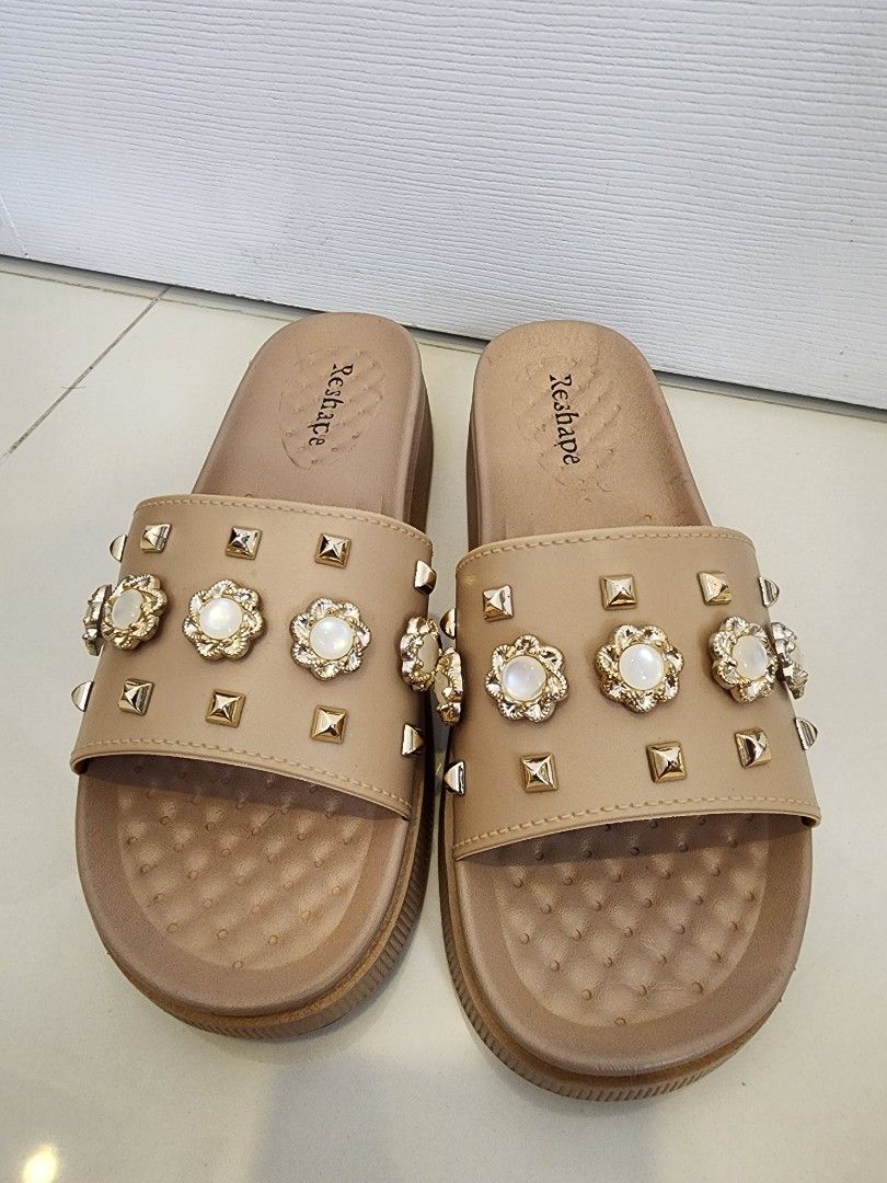 Reshape Decorated Slides Korean Style Size 40 (Category: Flats & Sandals) located in Quezon City. Submitted by pinkyshang (Listing ID 1464906976, Image 1). Description: - Brand: Reshape Decorated Slides Korean Style - Style: Casual Slip-On Sandals - Size: 40 (Model: LA-2258) - Color: Beige - Details: Upper strap decorated with metallic studs, floral accents and faux pearls - Comfort: Platform sole with a textured footbed - Condition: 2nd hand. Cl