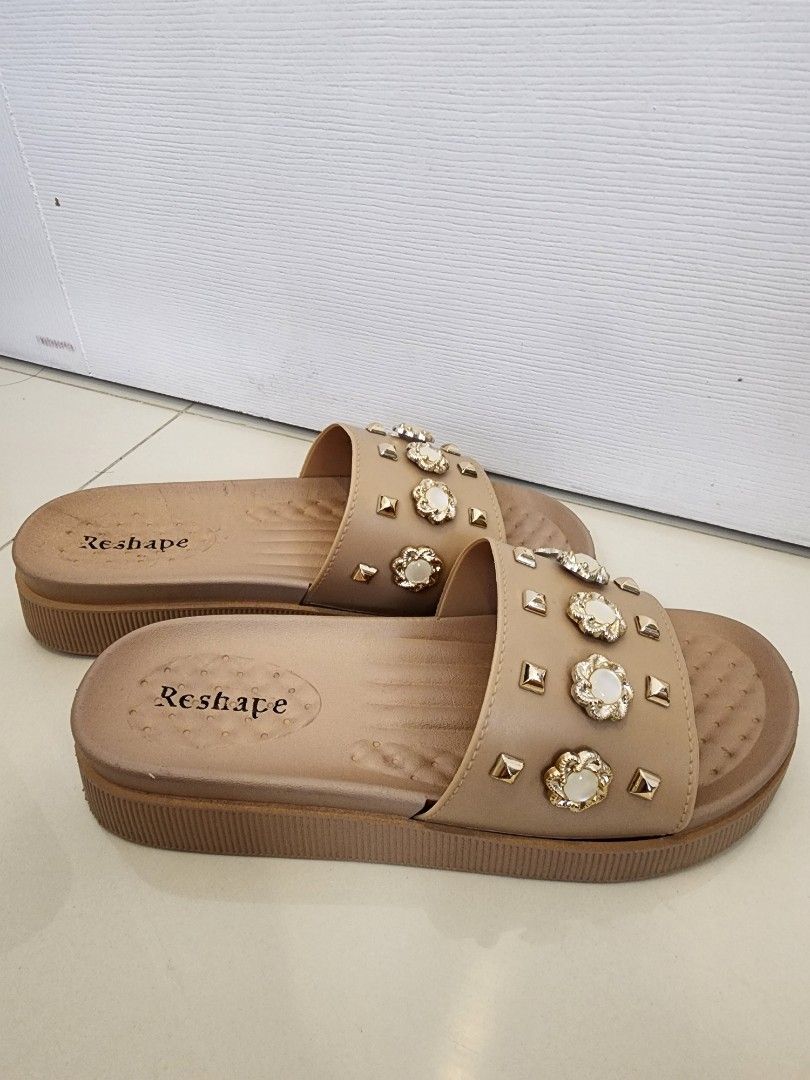 Reshape Decorated Slides Korean Style Size 40 (Category: Flats & Sandals) located in Quezon City. Submitted by pinkyshang (Listing ID 1464906976, Image 2). Description: - Brand: Reshape Decorated Slides Korean Style - Style: Casual Slip-On Sandals - Size: 40 (Model: LA-2258) - Color: Beige - Details: Upper strap decorated with metallic studs, floral accents and faux pearls - Comfort: Platform sole with a textured footbed - Condition: 2nd hand. Cl