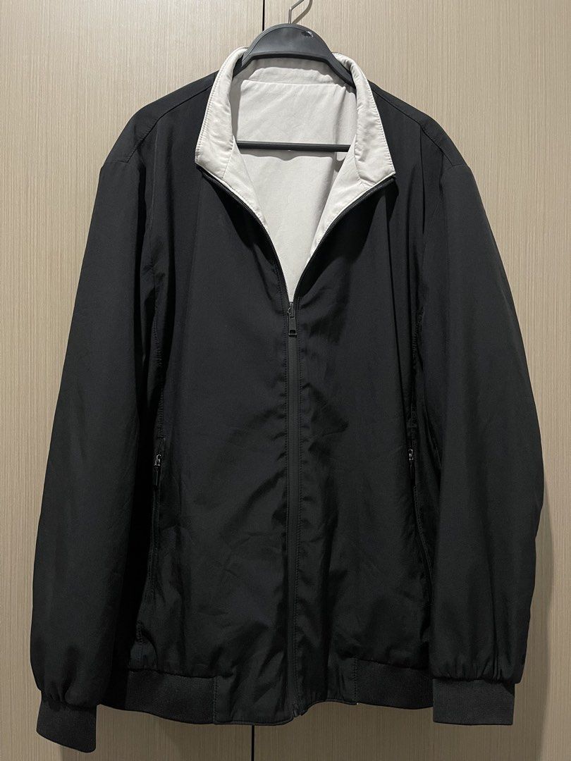 Reversible Black and Off-White Bomber Jacket (Category: Coats, Jackets and Outerwear) located in Taguig. Submitted by shennelaluuh (Listing ID 1464835642, Image 1). Description: - 2-in-1 reversible design: solid black and off-white - Full front zip closure - Comfortable ribbed collar, cuffs, and hem - Functional side pockets on both sides - Great layering piece for cool weather.