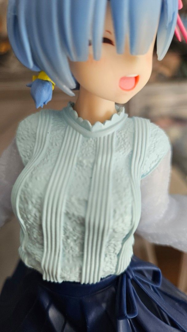 Re:Zero Rem Sweater Ver. PVC Figure (Category: Figurines & Statues) located in Taguig. Submitted by noblerabbit.c3b5a8 (Listing ID 1464916745, Image 2). Description: - Character: Rem from Re:Zero - Appearance: Blue twin tails with pink hairclips, light blue textured sweater, dark blue pleated skirt, and translucent sleeves - Accessories: Small yellow handbag with a chain strap - Condition: Loose/ No Box - Price is Negotiable.