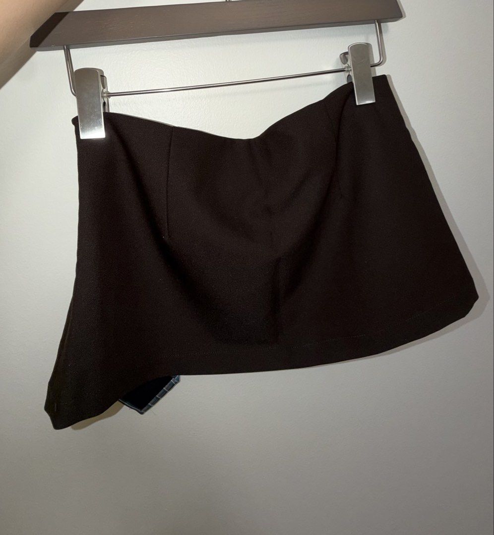 Rhice Mini Skirt with Tie (small) (Category: Skirts) located in Makati City. Submitted by epicdeer_3520cd (Listing ID 1464857593, Image 2). Description: *Brand: Rhice * Size: Small (S) * Color: Black with blue striped tie detail * Condition: Like new — only fitted once * No flaws or signs of wear Measurements: • Waist: 73 cm • Hips: 90 cm • Length: 26 cm.
