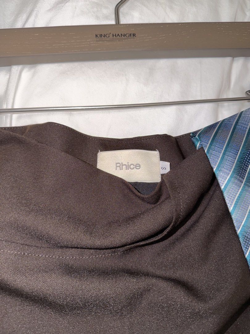 Rhice Mini Skirt with Tie (small) (Category: Skirts) located in Makati City. Submitted by epicdeer_3520cd (Listing ID 1464857593, Image 3). Description: *Brand: Rhice * Size: Small (S) * Color: Black with blue striped tie detail * Condition: Like new — only fitted once * No flaws or signs of wear Measurements: • Waist: 73 cm • Hips: 90 cm • Length: 26 cm.