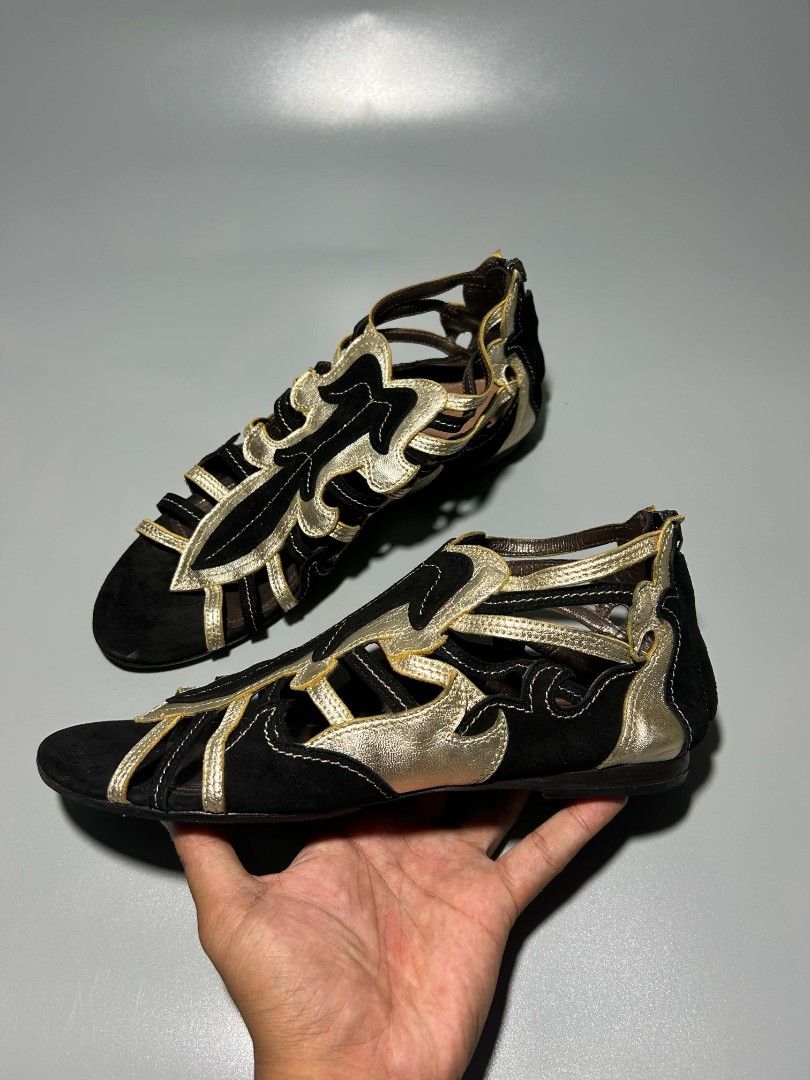 Roberto Cavalli (Category: Sneakers & Footwear) located in Bacolod City. Submitted by juanfindssss (Listing ID 1464922271, Image 3). Description: INCH? 🔊Roberto Cavalli ‼️Black/Gold Suede and Leather Flat Sandals distinguished by their striking black suede and metallic gold leather cutout design Size 38 Minor sign of usage free shipping you can add me on my FB account for vouch or VC 🙌 📩📩📩.