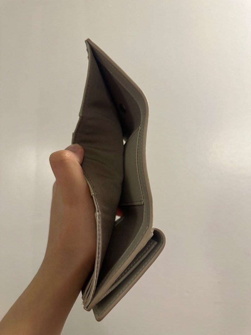 ROBINMAY Trifold Wallet Grey (Category: Wallets & Card holders) located in Makati City. Submitted by cosmicfire.4ba272 (Listing ID 1464913652, Image 3). Description: - Brand: ROBINMAY - Color: Sleek Grey - Style: Compact trifold wallet with minimalist design - Closure: Secure snap button - Storage: Multiple card slots and a dedicated cash compartment - Branding: Chic metal logo on the front - Condition: Brand new and 100% authentic - Perfect for 