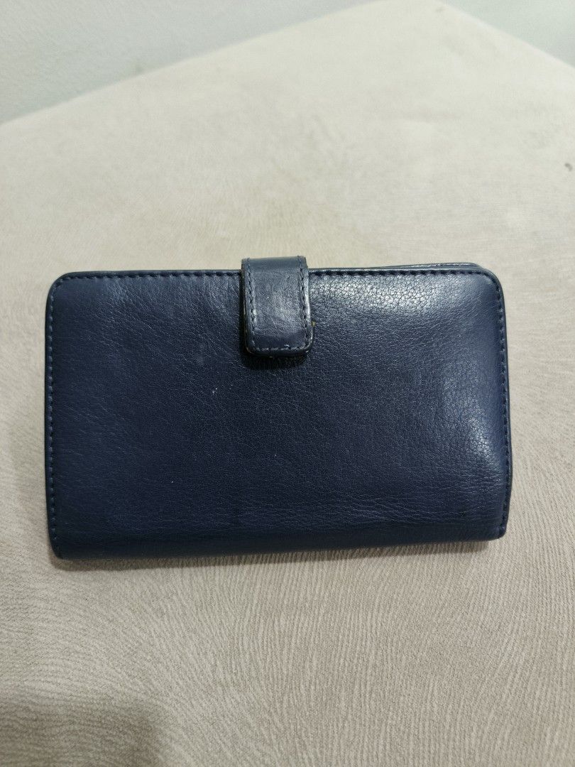 Salad Leather Wallet (Category: Wallets & Card holders) located in Quezon City. Submitted by closetraiders.mnl (Listing ID 1464903724, Image 2). Description: - Brand: Salad (AW 1929) - Color: Dark blue - Material: Leather - Hardware: Gold-tone logo plate on front snap flap - Interior: Multiple card slots, bill compartments, and fabric-lined zippered coin - Condition: Clean interior and exterior - Flaws: see last 2 photos.