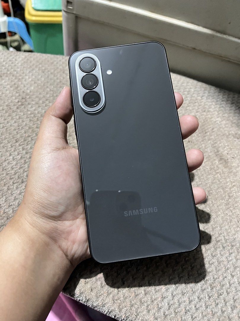 Samsung A37 5G 128GB (Category: Samsung) located in Manila. Submitted by edenroseg (Listing ID 1464814311, Image 3). Description: SAMSUNG Galaxy A37 5G is a smartphone that features a 6.7-inch FHD+ Super AMOLED display, 50MP + 8MP + 5MP triple rear cameras with OIS, and a 12MP selfie camera. It runs on an Exynos 1480 chipset with 8GB of RAM, Android 16 OS, OneUI 8 software and AI capabilities. There’s also an under-display fingerprint scanner, 5G