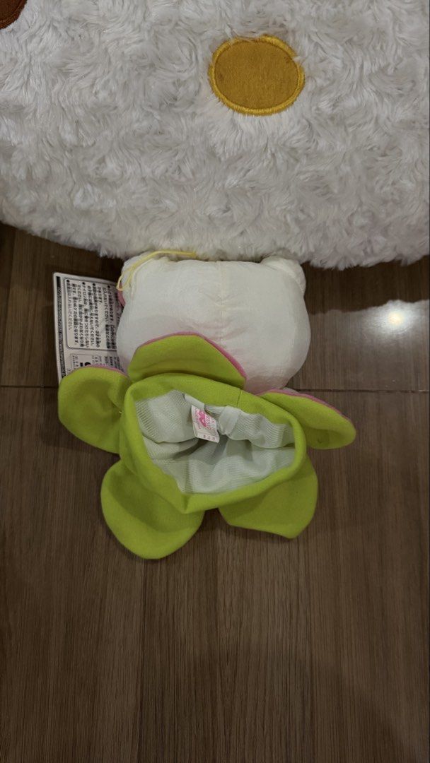 Sanrio Hello Kitty Flower Pouch Plush (Category: Plushies & Soft Toys) located in Cabadbaran. Submitted by cinnamororr (Listing ID 1464960868, Image 2). Description: - Authentic Banpresto Sanrio Kitty plush - Adorable green and pink flower pouch design - Features a functional bottom pocket/pouch opening - Equipped with a hanging loop at the top - Comes with original tag attached - Soft white fur body with classic pink bow and embroidered whiskers