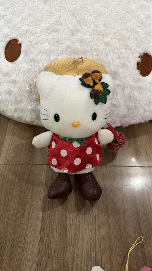 Sanrio Hello Kitty Plush (Category: Plushies & Soft Toys) located in Cabadbaran. Submitted by cinnamororr (Listing ID 1464961957, Image 1). Description: - Authentic Eikoh Kitty plush doll in excellent, clean condition with original cloth tag intact - Dressed in an adorable red polka dot dress, wide-brim hat, and brown boots - Features a cute green bow tie and an acorn and leaf accessory near the ear.