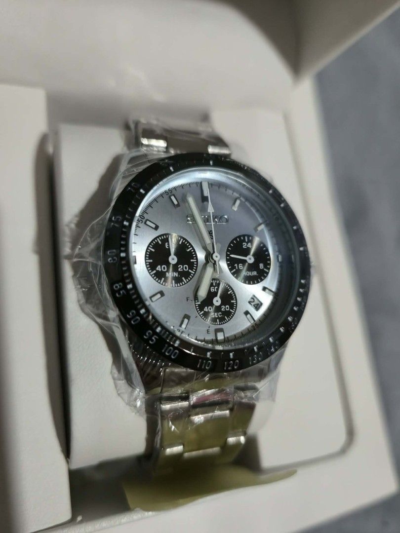 Seiko Chronograph Watch (Category: Men's Watches) located in Caloocan City. Submitted by happyhorse.eb21f3 (Listing ID 1464887443, Image 2). Description: - Brand: Seiko Chronograph Watch Replica - Dial: Silver sunburst with 3 sub-dials and date window between 4 and 5 o'clock - Bezel: Stylish black tachymeter - Strap: Durable stainless steel bracelet links - Condition: Brand new, still wrapped in original factory protective plastic - Inclusion: Co