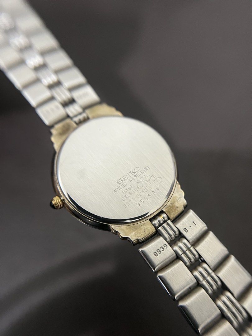 Seiko Lucent Two-Tone Roman Dial Quartz – Ref. 5E21-6C40 (Category: Men's Watches) located in Quezon City. Submitted by bobby.brown. (Listing ID 1464909309, Image 2). Description: Seiko Lucent Two-Tone Roman Dial Quartz – Ref. 5E21-6C40 Estimated BMBY: May 1993 A refined classic dress watch from Seiko’s Lucent line, featuring a polished round base metal case highlighted by gold-tone accents and a cabochon-tipped crown. The light silver sector dia