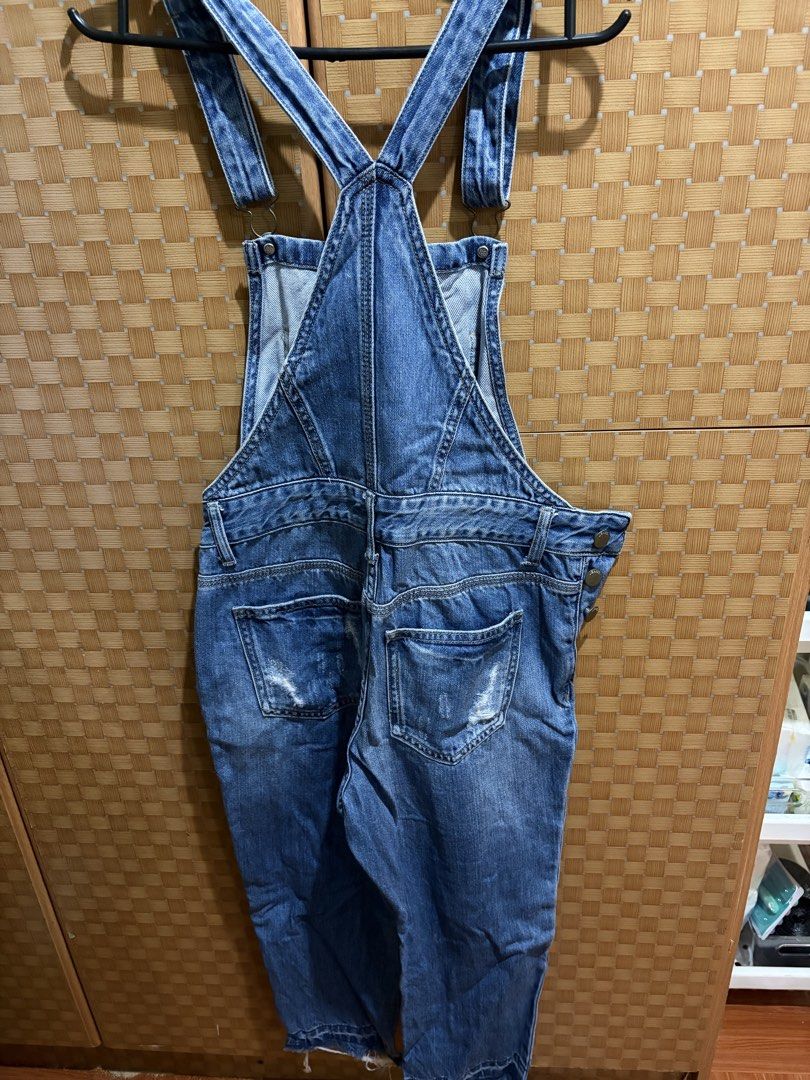 Semir Distressed Denim Overalls Size S 155/62A (Category: Jumpsuits) located in Pangil. Submitted by chel_anne (Listing ID 1464843337, Image 3). Description: - Brand: Semir - Style: Denim overalls / Dungarees - Color/Wash: Medium blue wash - Size: S (155/62A) - Details: Distressed ripped knees, frayed hems - Pockets: Classic front bib pocket, plus functional side and back pockets - Fit: Adjustable shoulder straps and side button closures.