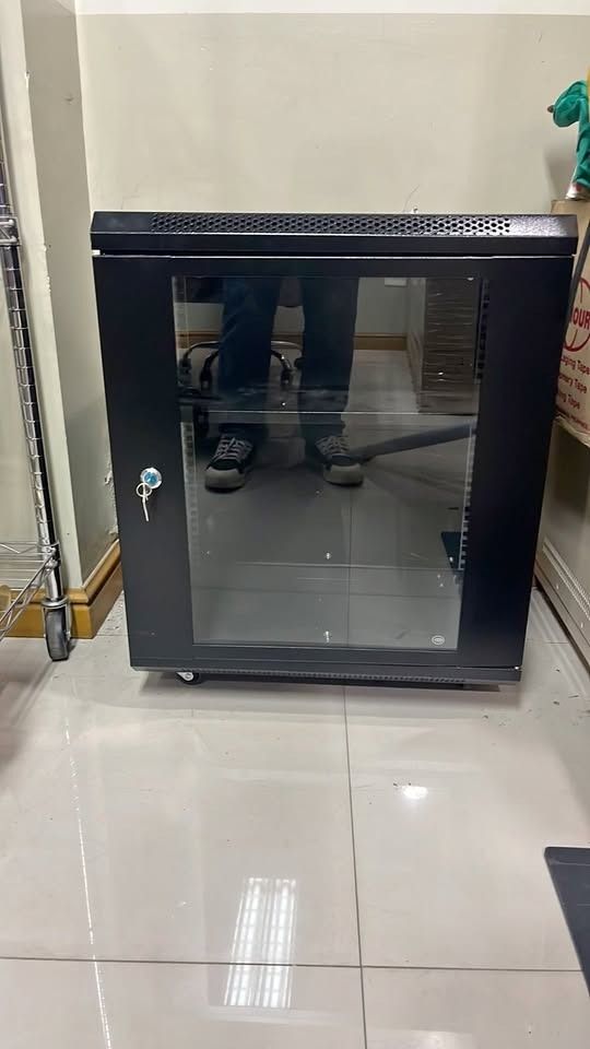 Server rack cabinet | Data Rack (Category: Shelves, Cabinets & Racks) located in Manila. Submitted by cyrenejoye (Listing ID 1464822187, Image 2). Description: - Color: Black - Build: Solid metal construction, sturdy and heavy-duty - Doors & Panels: Glass front door, side panels, side access doors, and vented top panel - Organization: Built-in cable management slots and standard rack mount layout - Condition/Handling: Heavy unit, strict pickup on