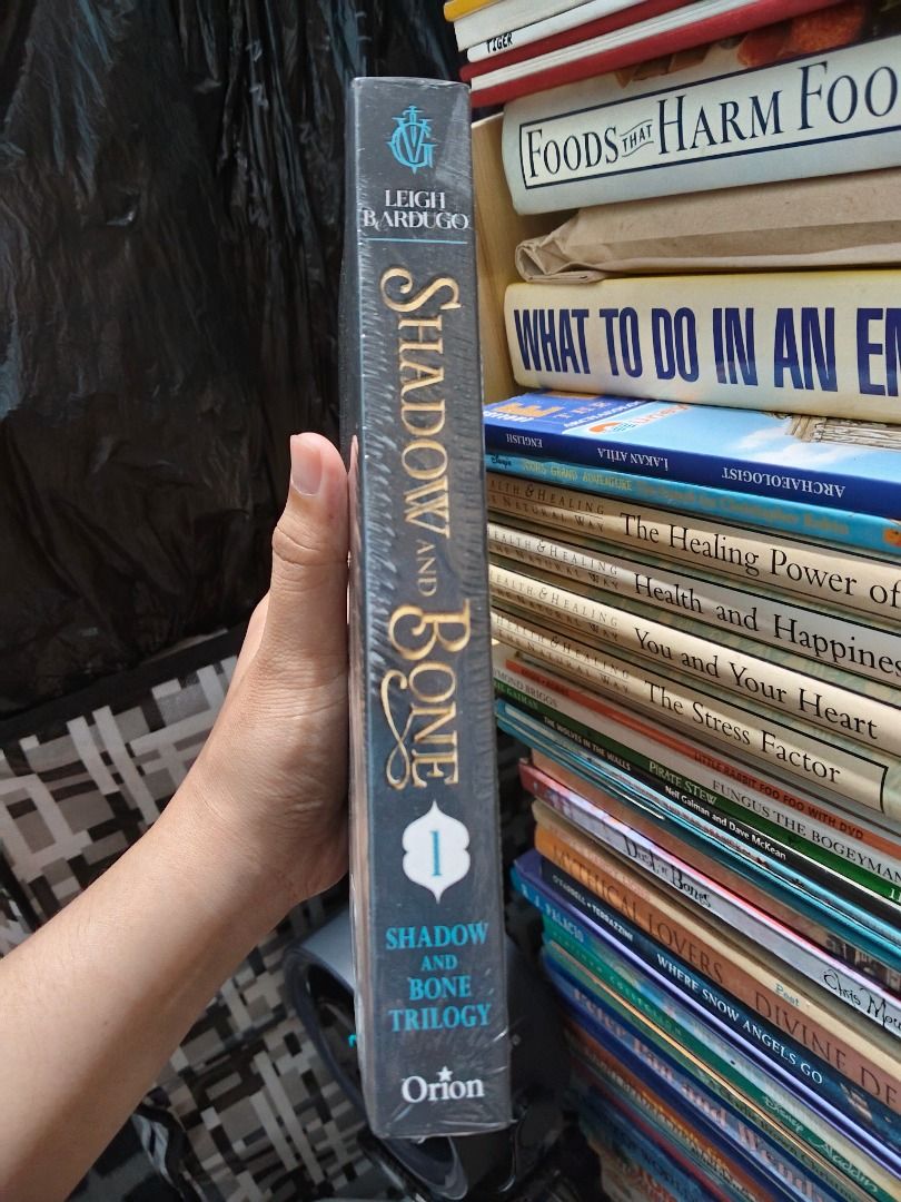 Shadow and Bone by Leigh Bardugo Paperback (Category: Storybooks) located in Taguig. Submitted by jener.498 (Listing ID 1464925810, Image 2). Description: Shadow and Bone by Leigh Bardugo. First book in the Shadow and Bone Trilogy. Netflix tie-in edition with the original series cover art. Still sealed in the original plastic wrapping. Unopened and untouched. Great fantasy read for fans of the show or book collectors wanting a pristine copy..