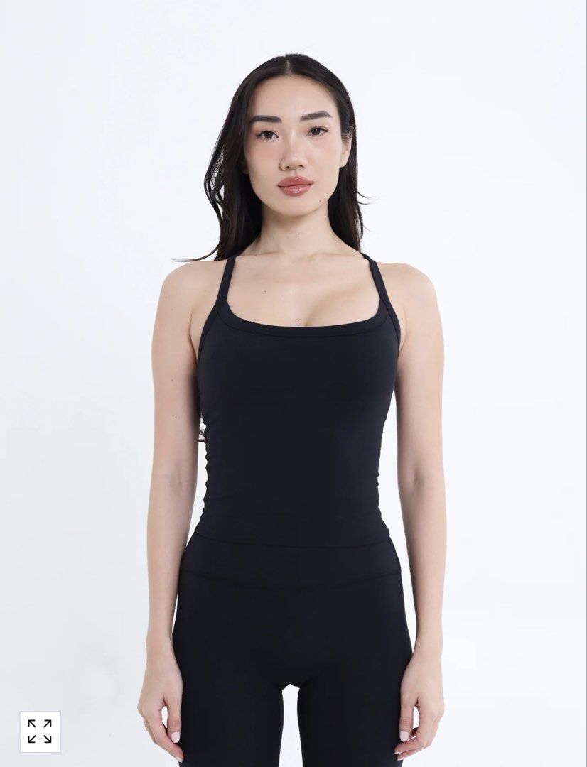SHAPE Black Racerback Activewear Tank Top (Category: Activewear) located in Mandaluyong City. Submitted by luvieestbelle (Listing ID 1464868381, Image 1). Description: - Brand: SHAPE - Color: Black - Style: Scoop neck with skinny racerback - Details: Small 'S' logo on back collar - Fit: Soft, stretchy fabric that hugs the body closely - Length: Sits right around the hip line - Ideal for: Workouts, gym sessions, and pairing with matching leggings 