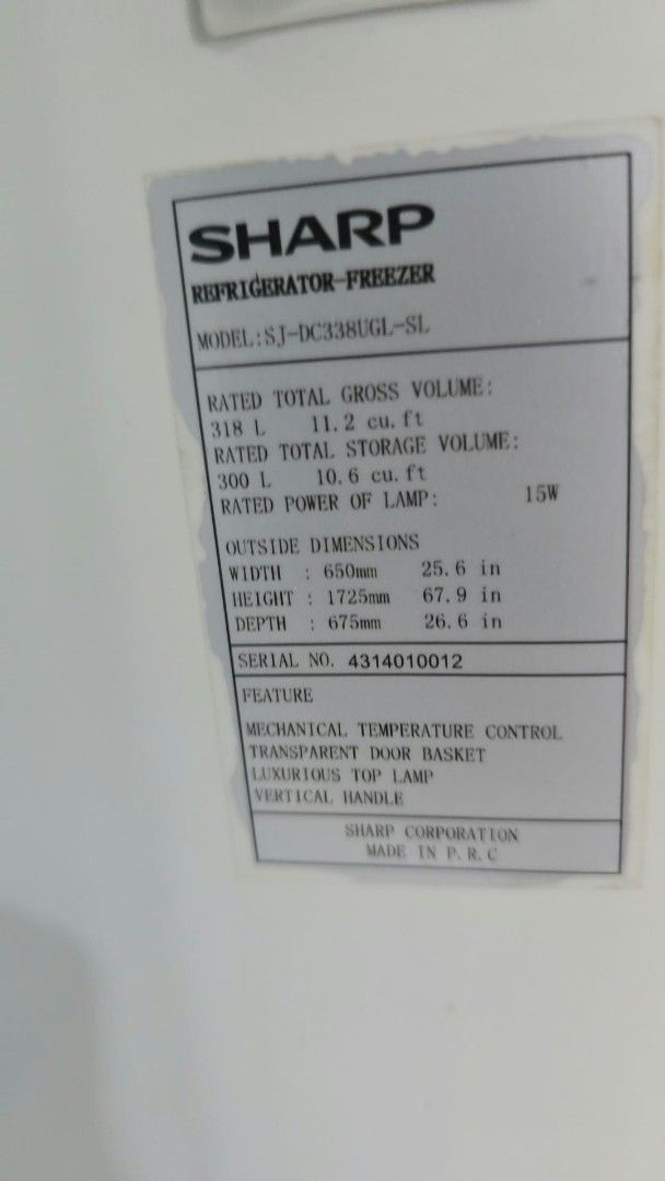 Sharp Refrigerator SJ-DC338UGL-SL 318L Two Door (Category: Refrigerators and Freezers) located in Caloocan City. Submitted by mjting01 (Listing ID 1464828705, Image 2). Description: - Brand/Model: Sharp SJ-DC338UGL-SL 2-door fridge in sleek silver finish - Capacity: 318L gross volume / 300L storage volume - Features: Mechanical temperature control, vertical handles, transparent door baskets, and durable wire shelving - Dimensions: Approx. 650mm (