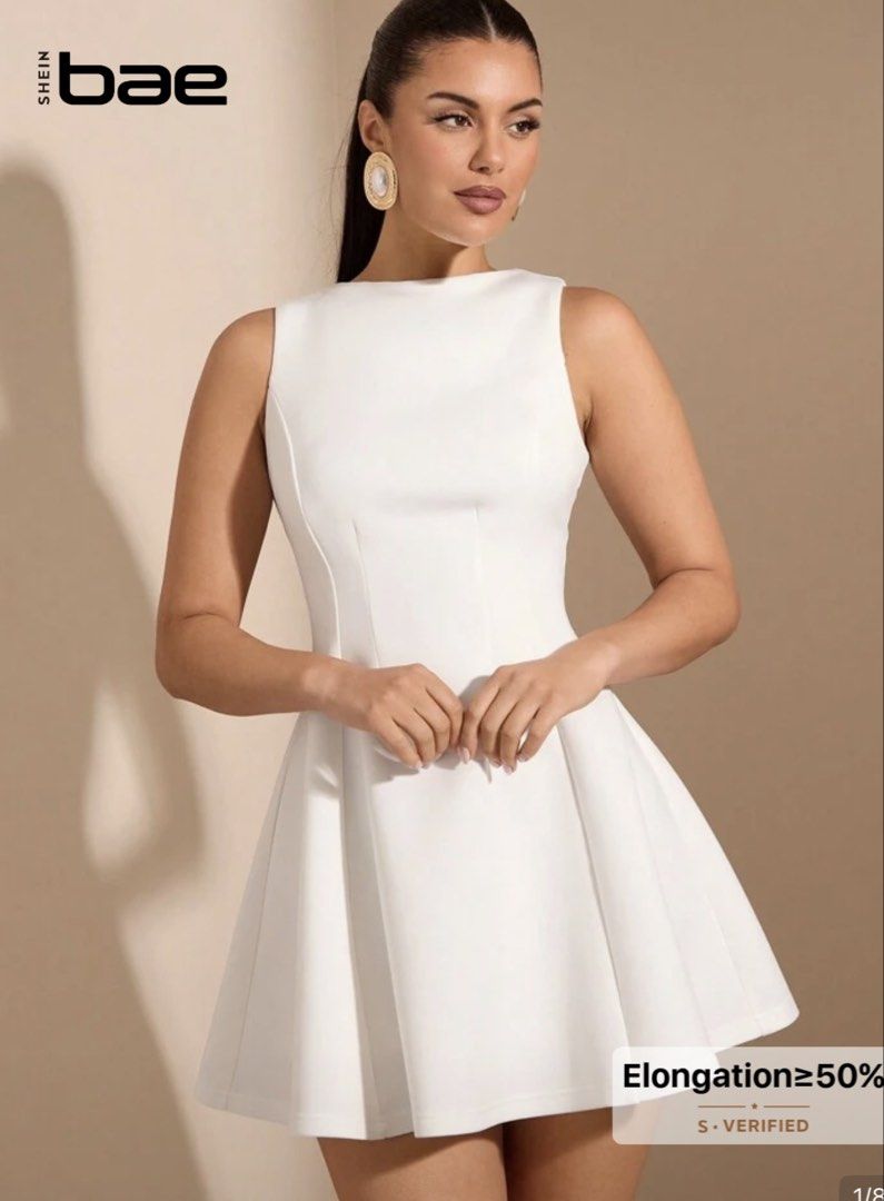 SHEIN BAE White Sleeveless Mini Dress (Category: Dresses) located in Manila. Submitted by garnet.biz (Listing ID 1464824436, Image 1). Description: - Brand: SHEIN BAE - Color: Clean solid white - Style: Sleeveless mini dress with fitted bodice and flared skater skirt - Neckline: High boat neckline - Fabric: Structured with comfortable stretch - Length: Short, hits above the knee - Condition: Great, worn once for photos only.