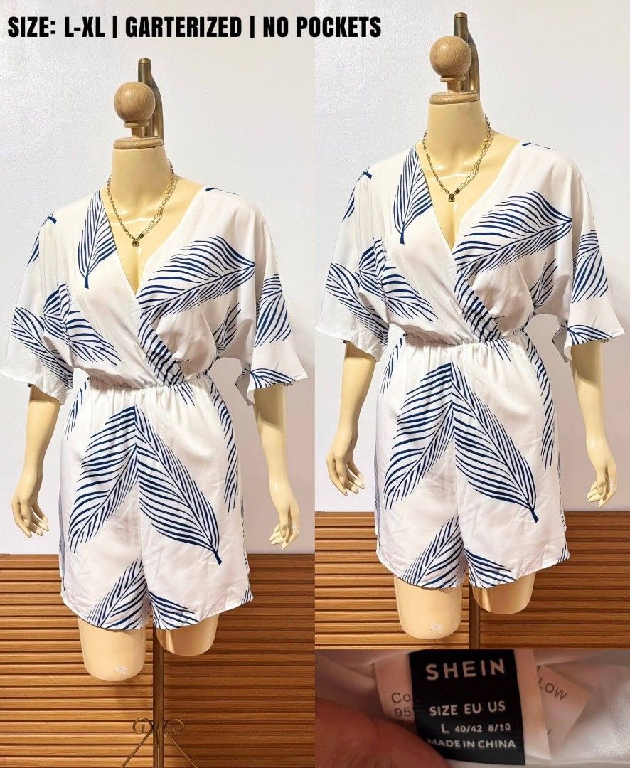 SHEIN Blue Leaf Print Wrap Romper Size L-XL (Category: Rompers) located in Pasay City. Submitted by trendyclothes09 (Listing ID 1464891875, Image 1). Description: - Brand: Shein - Size: Fits L to XL - Design: White with all-over blue leaf pattern, wrap front, short sleeves - Waist: Elastic garter for a comfortable fit - Features: No pockets, super lightweight fabric ideal for warm days.