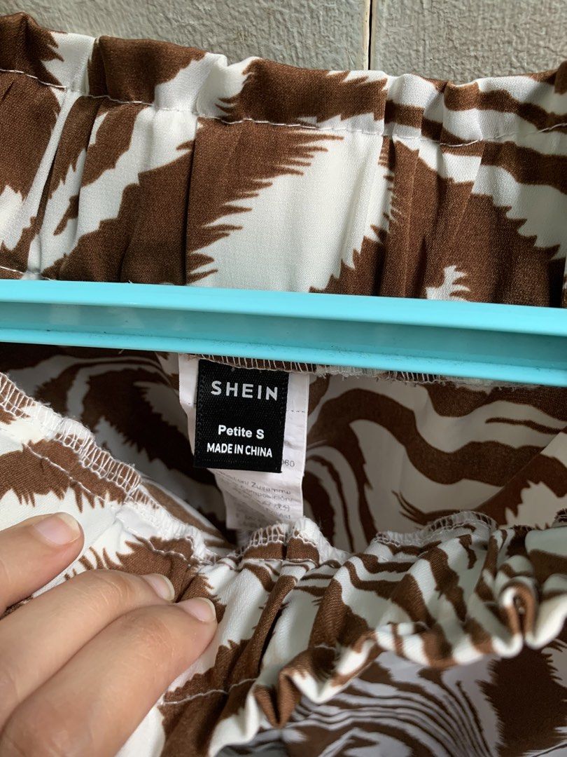SHEIN Brown Zebra Print Petite S Pants (Category: Jeans) located in Manila. Submitted by usagichan_rabbit (Listing ID 1464842603, Image 2). Description: - Brand: SHEIN - Style: Brown and white zebra pattern, relaxed wide leg - Waist: Elastic high waist with gathered ruffle detail - Material: Lightweight fabric - Size: Petite S - Condition: Worn a few times, still in great shape.
