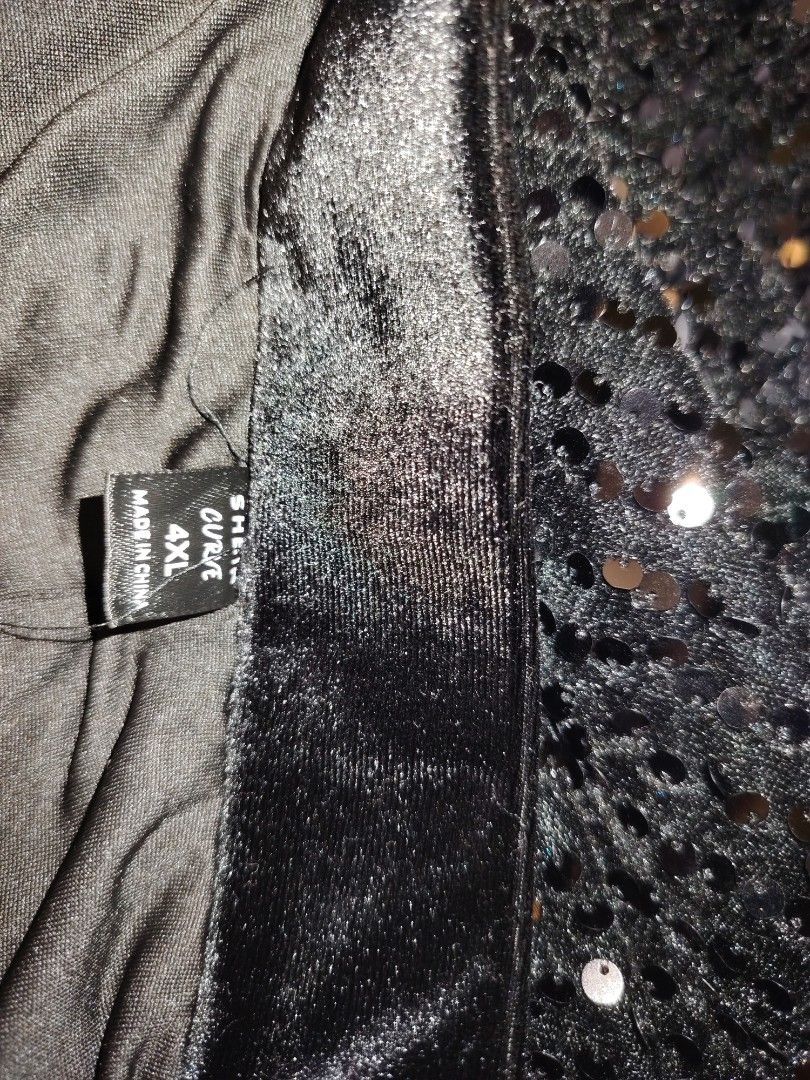 Shein Curve Black Sequin Skirt (Category: Skirts) located in Manila. Submitted by babeboxtheory (Listing ID 1464900749, Image 3). Description: - Brand: Shein Curve - Size: 4XL - Color: Classic Black - Details: Fully covered in sparkling sequins with a stylish black feather-trimmed hem - Comfort: Features a soft velvet waistband and smooth inner lining - Occasion: Perfect for parties, holidays, and evening events - Condition: Excellent.