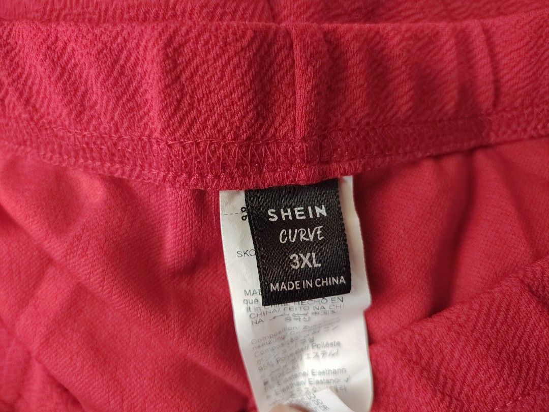 SHEIN Curve Red Pearl Beaded Split Hem Pants (Category: Jeans) located in Manila. Submitted by babeboxtheory (Listing ID 1464900964, Image 3). Description: SHEIN Curve red pants in size 3XL. Textured stretchy fabric with faux pearl bead trim down both legs. Slit design at the ankles. 95% polyester, 5% elastane. Made in China..