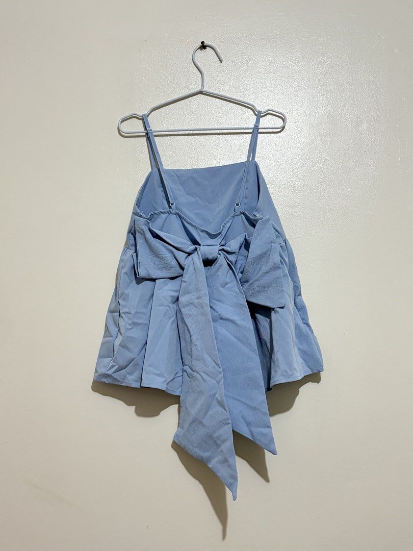 Shein Light Blue Spaghetti Strap Peplum Top with Bow (Category: Sleeveless) located in Cainta. Submitted by knarv__ (Listing ID 1464883892, Image 2). Description: Light blue Shein peplum top in size S. Features a square neckline, spaghetti straps, and a cute statement bow at the back. Made of lightweight, textured fabric—perfect for warm weather!.