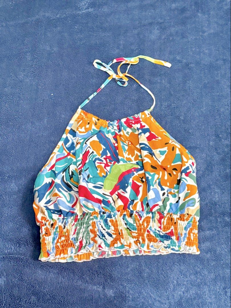 Shein Smocked Halter Neck Crop Top - Size Small-Medium (Category: Sleeveless) located in Manila. Submitted by wtsjaemin (Listing ID 1460768461, Image 1). Description: - Colorful floral print halter neck crop top from Shein - Smocked waist for a comfortable and flattering fit - Ties at the neck for adjustable styling - Size: Small to Medium (S-M) - Perfect for a cute and trendy look! - Comment 'MINE / STEAL / LOCK + CODE' to claim this item!.