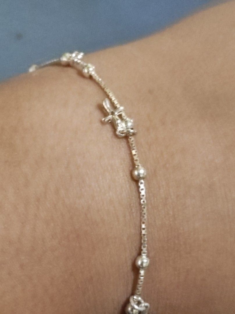Silver Bracelet with Cross Charms and Beads (Category: Bracelets) located in Cavite. Submitted by noblepenguin_6c8662 (Listing ID 1464860665, Image 1). Description: - 925 Silver box chain bracelet with multiple cross charms and round bead accents - Lightweight and delicate design, perfect for daily wear -Fits to Size 7-7.5 inches - Easy to pair and stack with other wrist accessories - Secured with a reliable spring ring clasp - Includes an adjust