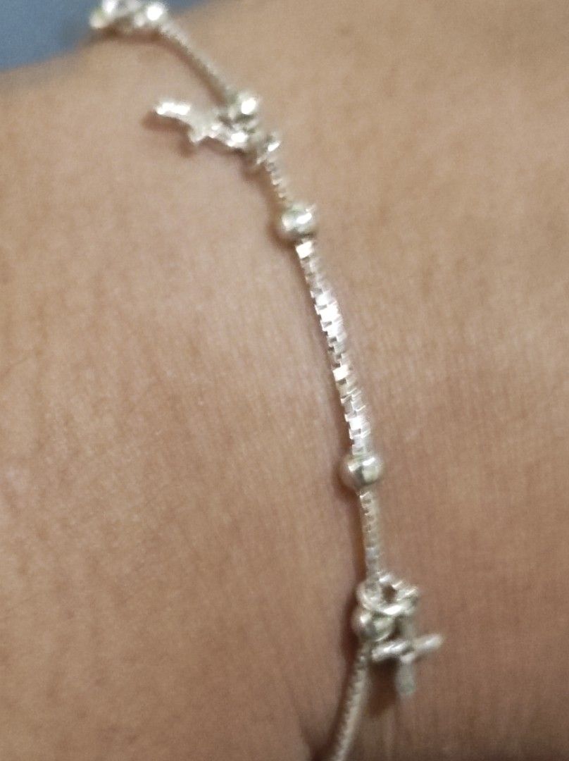 Silver Bracelet with Cross Charms and Beads (Category: Bracelets) located in Cavite. Submitted by noblepenguin_6c8662 (Listing ID 1464860665, Image 3). Description: - 925 Silver box chain bracelet with multiple cross charms and round bead accents - Lightweight and delicate design, perfect for daily wear -Fits to Size 7-7.5 inches - Easy to pair and stack with other wrist accessories - Secured with a reliable spring ring clasp - Includes an adjust