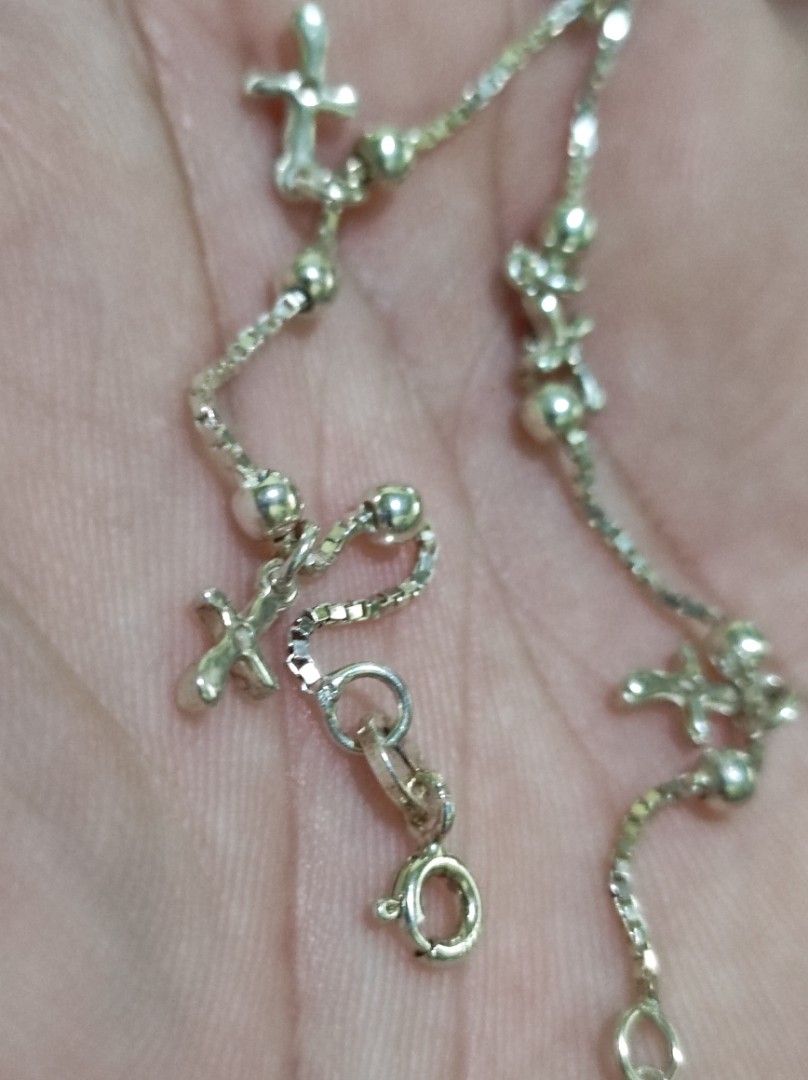 Silver Bracelet with Cross Charms and Beads (Category: Bracelets) located in Cavite. Submitted by noblepenguin_6c8662 (Listing ID 1464860665, Image 2). Description: - 925 Silver box chain bracelet with multiple cross charms and round bead accents - Lightweight and delicate design, perfect for daily wear -Fits to Size 7-7.5 inches - Easy to pair and stack with other wrist accessories - Secured with a reliable spring ring clasp - Includes an adjust