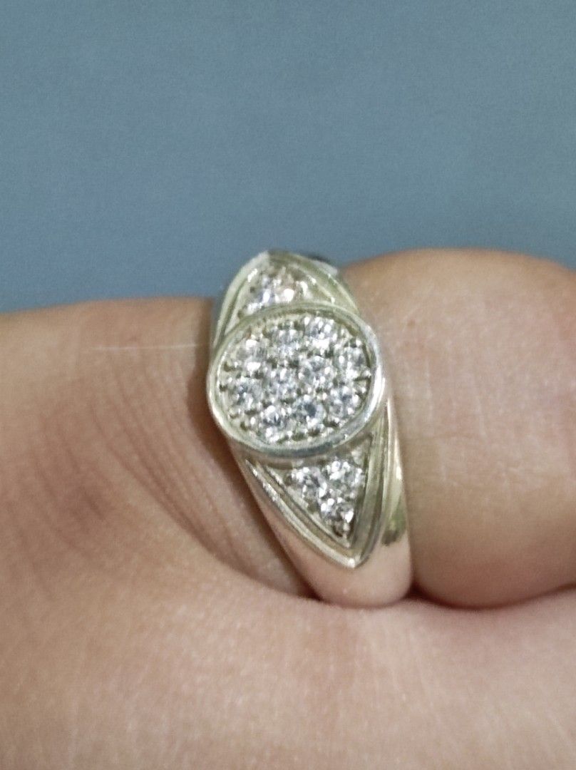 Silver 925 EStatement Ring with White Stones (Category: Rings) located in Cavite. Submitted by noblepenguin_6c8662 (Listing ID 1464859712, Image 3). Description: - Material/Finish: Heavy silver band with a clean, polished finish - Design: Evil-Eye design Round center pave cluster with sparkling side cryst - Style: Bold statement piece, versatile for daily wear or special occasions - Condition: Excellent, shiny, and well-maintained - Shipping: Fas