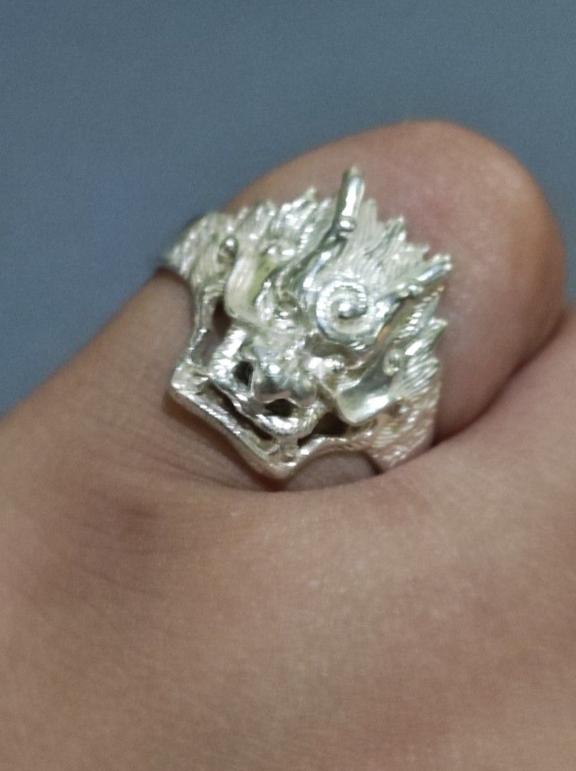 Silver Dragon Head Ring (Category: Rings) located in Cavite. Submitted by noblepenguin_6c8662 (Listing ID 1464527021, Image 1). Description: - Unique dragon head ring design - Made of genuine silver 925 - Adds an edgy touch to your style - Shows some signs of wear, but overall looks awesome - A true statement piece -size 12, 6.5g.