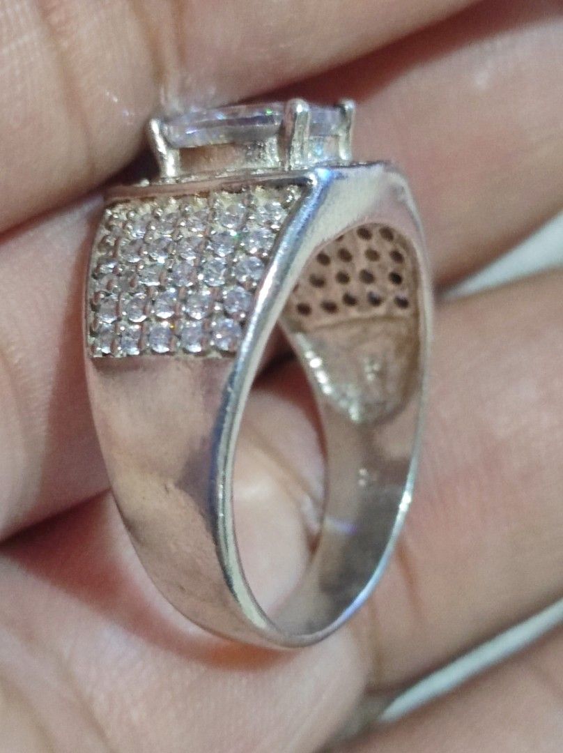 Silver Oval Tourmaline Ring with Pave Band (Category: Rings) located in Cavite. Submitted by noblepenguin_6c8662 (Listing ID 1464896593, Image 2). Description: - Bold Silver cocktail ring with a large oval Tourmaline center stone - Surrounded by smaller clear possibly zirconia stones and heavily encrusted pave crystals - Features an intricate cutout backing behind the main setting - Substantial, high-quality weight for a luxurious feel.