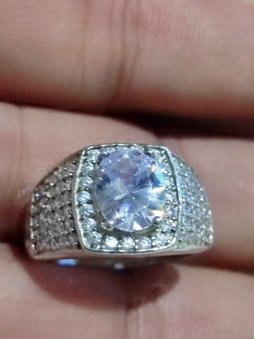 Silver Oval Tourmaline Ring with Pave Band (Category: Rings) located in Cavite. Submitted by noblepenguin_6c8662 (Listing ID 1464896593, Image 1). Description: - Bold Silver cocktail ring with a large oval Tourmaline center stone - Surrounded by smaller clear possibly zirconia stones and heavily encrusted pave crystals - Features an intricate cutout backing behind the main setting - Substantial, high-quality weight for a luxurious feel.