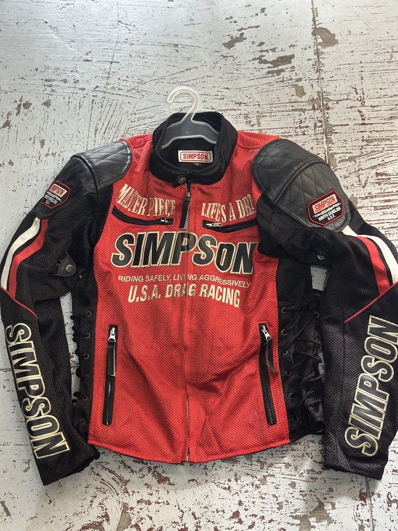 Simpson Motorcycle Jacket (Category: Helmets and other Riding Gears) located in Iloilo. Submitted by toppingsboutique2.0 (Listing ID 1464797527, Image 1). Description: • Brand: Simpson (Simpson Performance Products) • Model: SJ-5116 • Color: Red and black • Design/Details: Breathable mesh core with contrasting black panels, side lace-up adjustments, and embroidered • Protection: Comes equipped or compatible with shoulder, elbow, and spine/back ar