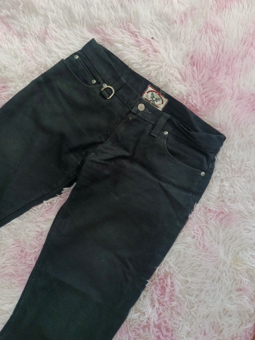 Skull Flight Knockin on Hell's Door Black Pants (Category: Jeans) located in Jolo. Submitted by zah-zah (Listing ID 1464787411, Image 3). Description: - Brand: Skull Flight ('Knockin on Hell's Door' interior tag) - Color: Solid black - Material: Heavy-duty denim build - Features: Zipped ankle hems for easy riding, front D-ring near the waistband - Pockets: Flap back pockets with metal hardware studs and a graphic patch on the left side - Conditio