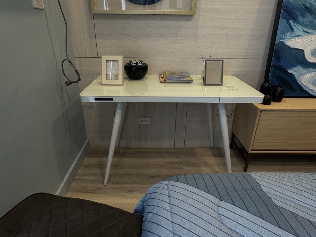 Sleek Minimalist Desk office table Study table Tempered Glass Table (Category: Tables & Sets) located in Manila. Submitted by gotlistedph (Listing ID 1444871068, Image 1). Description: For Sale: Modern White Tempered Glass Table ✨ Table Only Repriced from 12,000 to 9,900 * White tempered glass top * Size: 120 cm * Built-in drawer * Sturdy white steel legs * Built-in Bluetooth speaker * Touch-sensitive controls * USB charging port A sleek and func